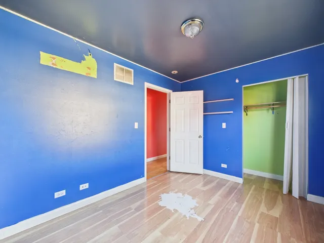 a view of empty room with window and stairs