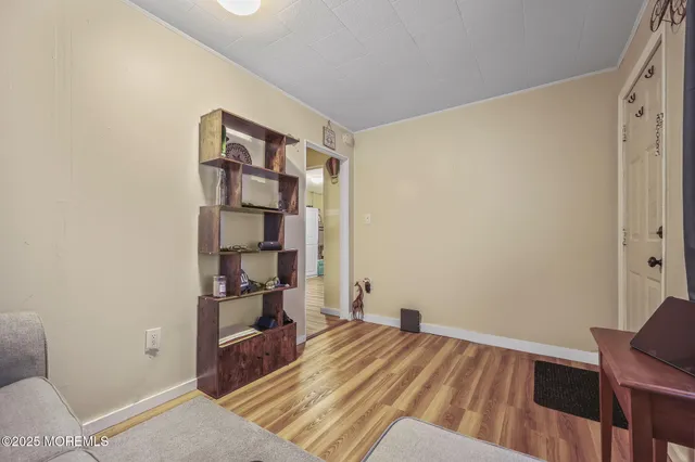 a room with a bed and furniture