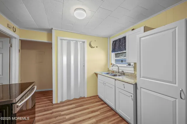 a kitchen with a sink and cabinets