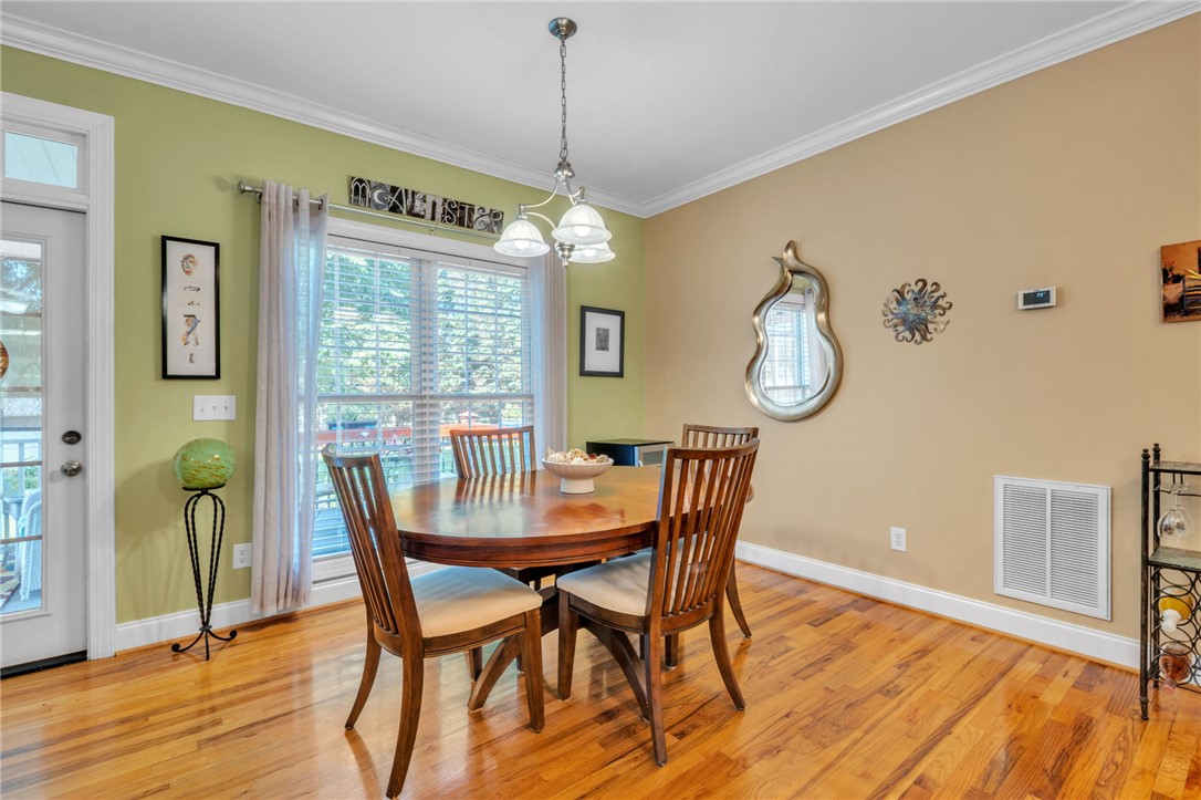 648 Mountain View Road Williamston, SC 29697 - Photo 8 of 42 Hardwood floors and a bright window illuminate this delightful dining space, perfect for everyday meals.