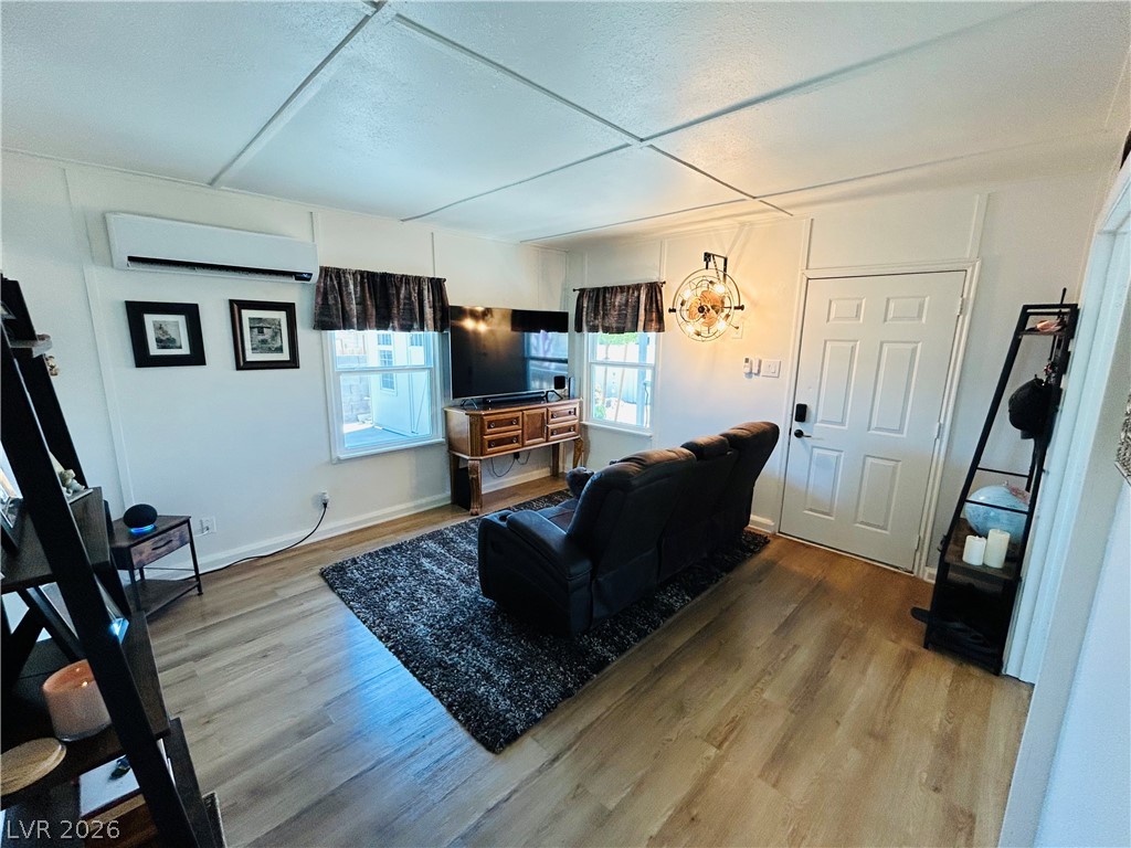 116 West Basic Road Henderson, NV 89015 - Photo 21 of 39 Step into this well-lit living area featuring beautiful flooring and generous natural light.