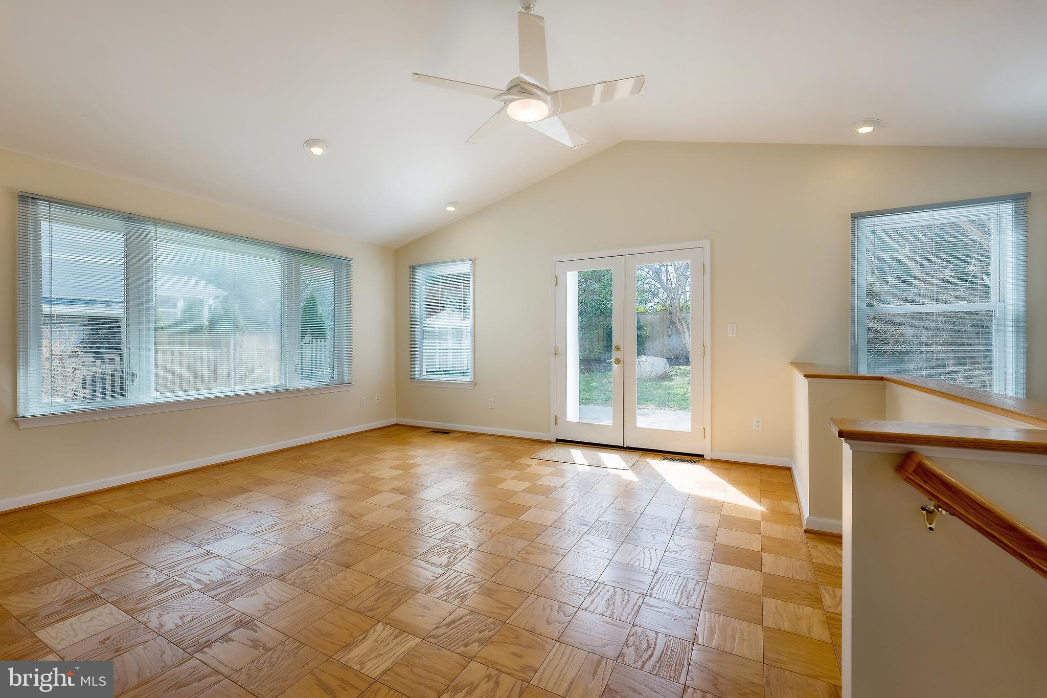 6504 Stratford Road Chevy Chase, MD 20815 - Photo 16 of 54 a view of an empty room with a window and wooden floor