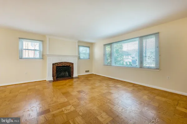 a view of an empty room with windows