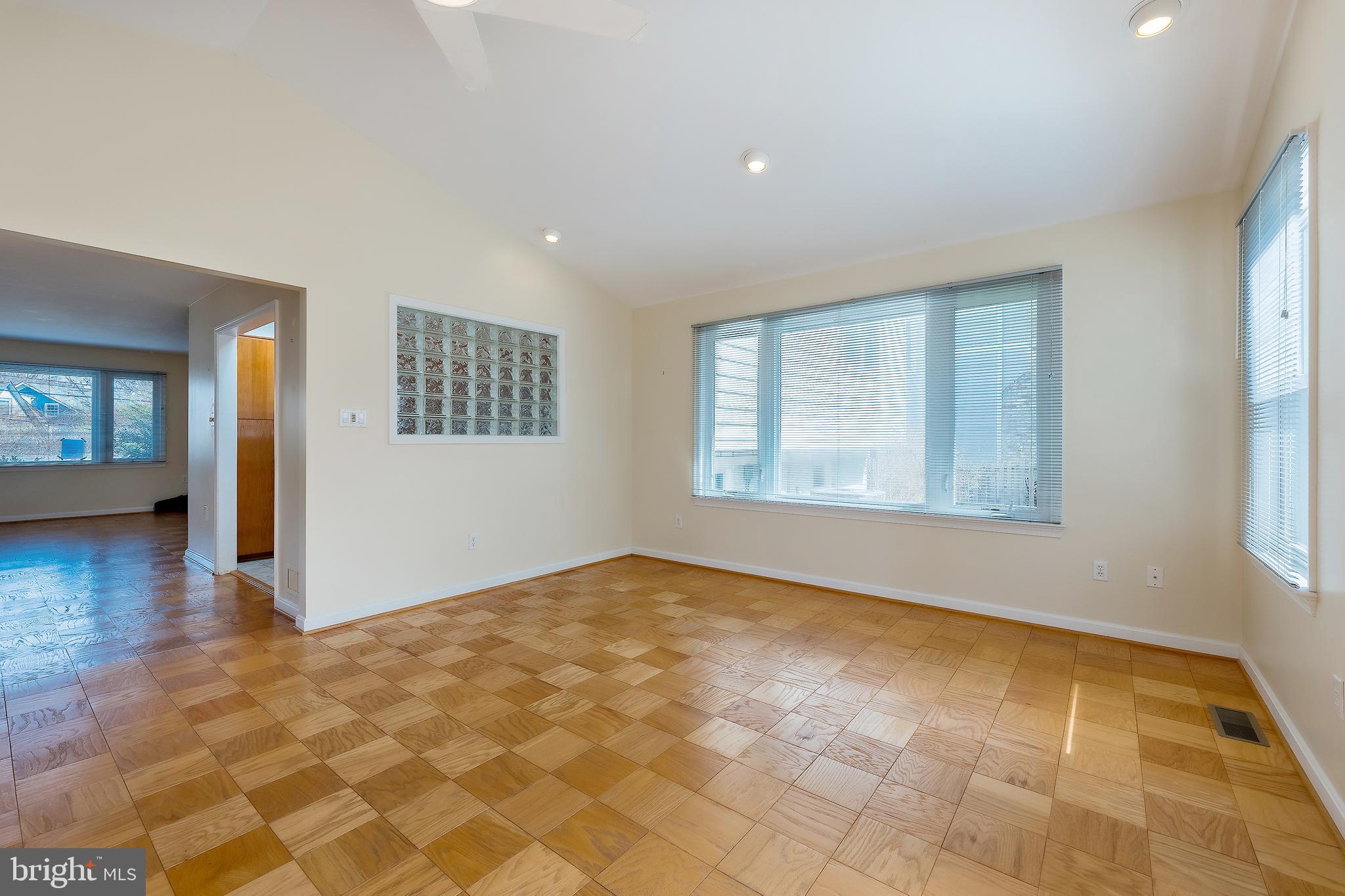 6504 Stratford Road Chevy Chase, MD 20815 - Photo 20 of 54 a view of an empty room with window and wooden floor
