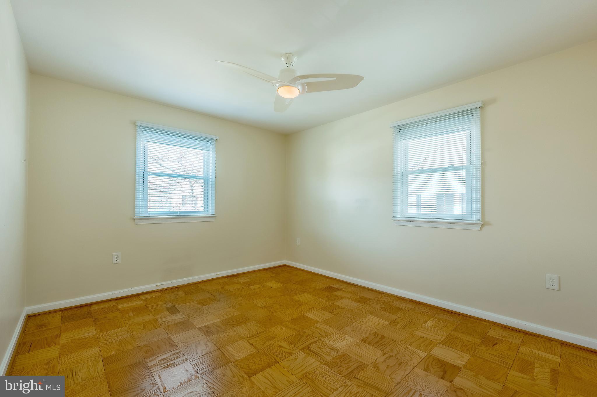 6504 Stratford Road Chevy Chase, MD 20815 - Photo 30 of 54 a view of a room with a window and a ceiling fan