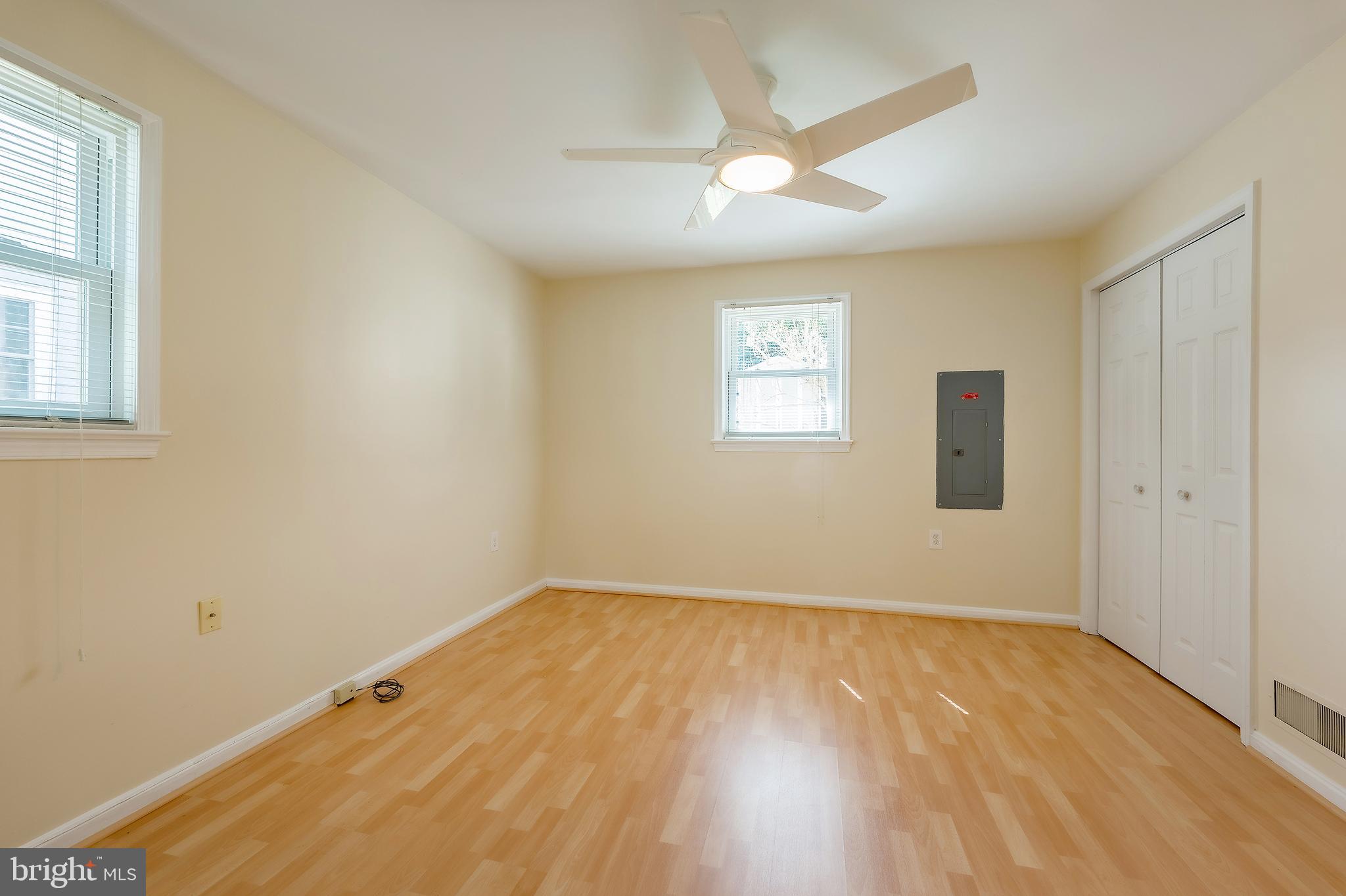 6504 Stratford Road Chevy Chase, MD 20815 - Photo 37 of 54 wooden floor in an empty room with a window