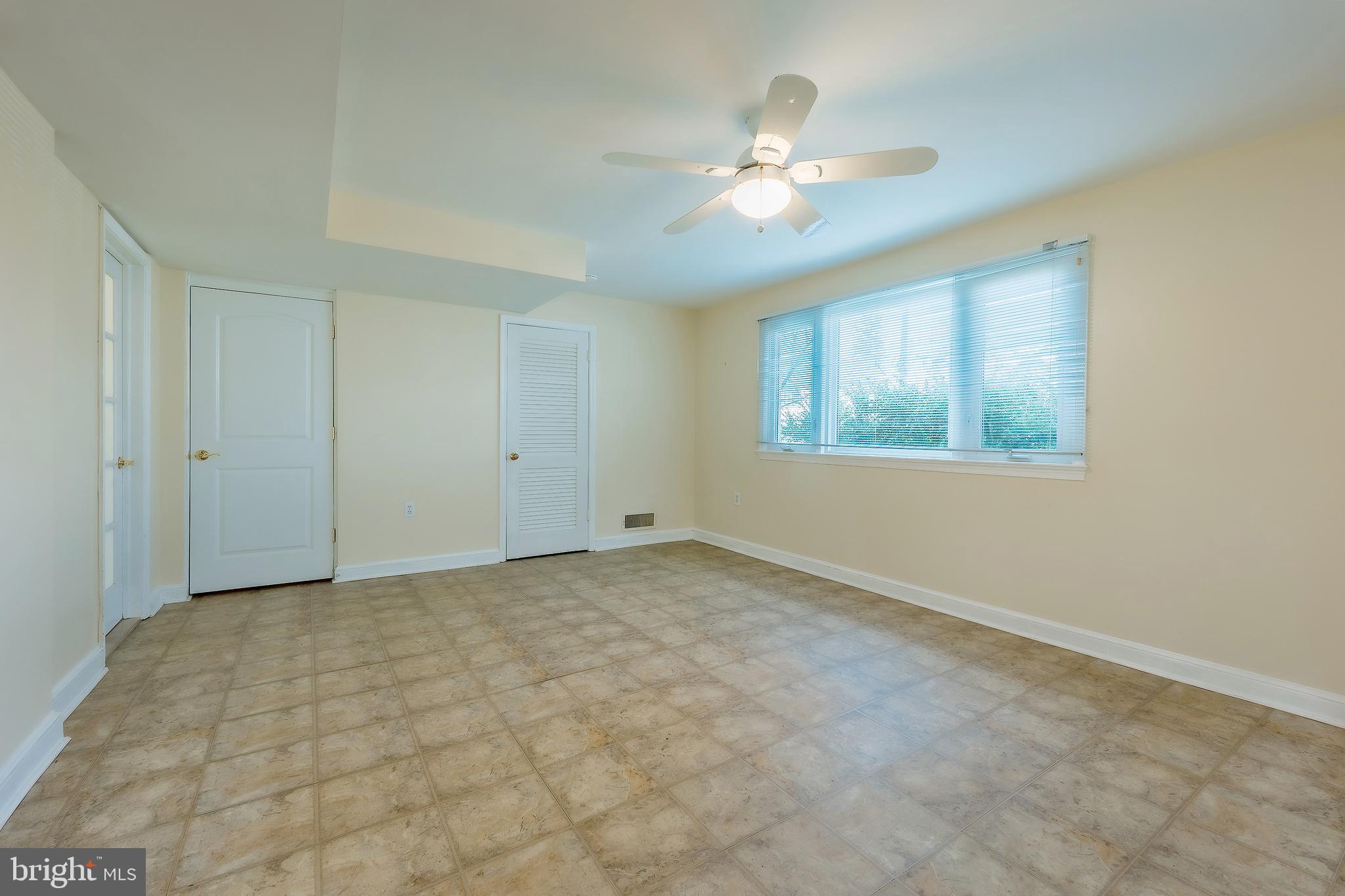 6504 Stratford Road Chevy Chase, MD 20815 - Photo 42 of 54 a view of an empty room with a chandelier fan