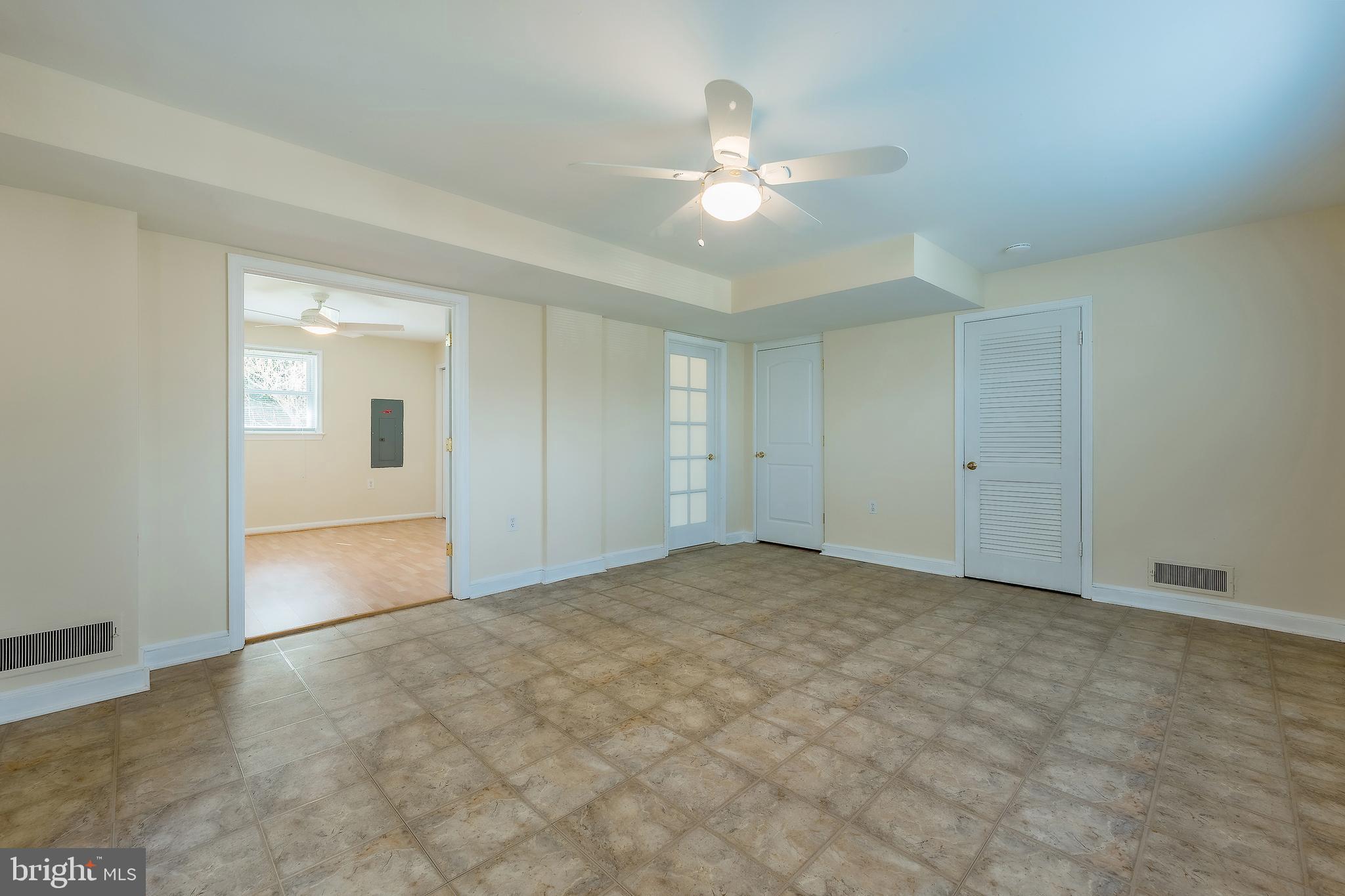 6504 Stratford Road Chevy Chase, MD 20815 - Photo 43 of 54 a view of an empty room with a chandelier fan
