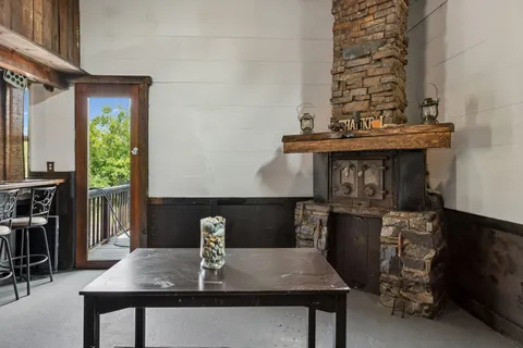 a kitchen with a table chairs and a stove