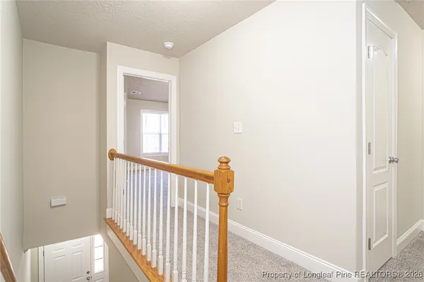 a view of a hallway with a window