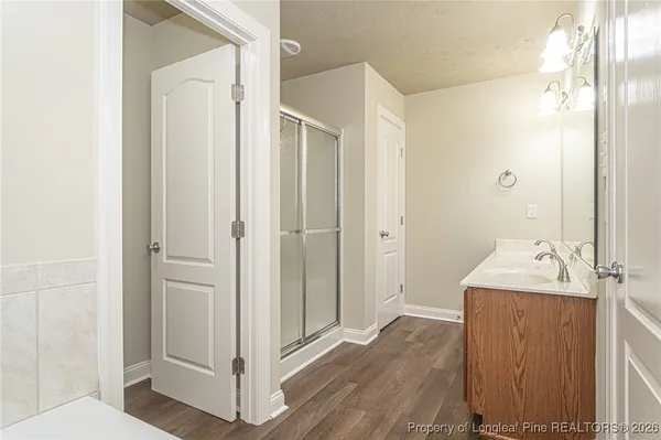 a bathroom with a sink and mirror