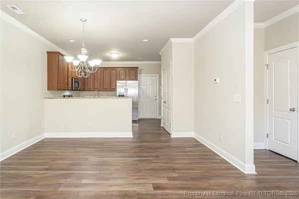 a view of a kitchen and a chandelier