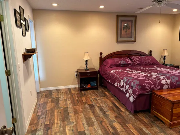 a bedroom with a bed and a dresser