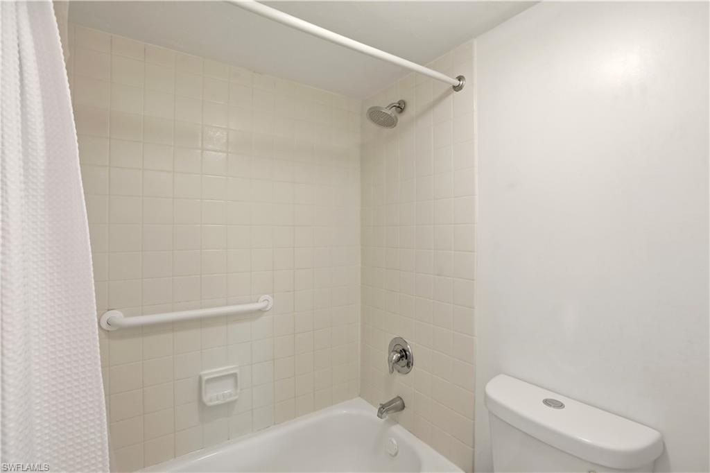 600 Neapolitan Way, Unit 254 Naples, FL 34103 - Photo 24 of 42 Full bathroom with shower / tub combo and toilet