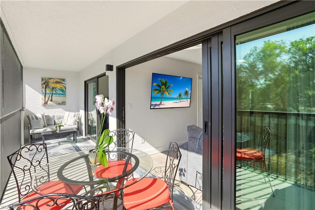 600 Neapolitan Way, Unit 254 Naples, FL 34103 - Photo 28 of 42 View of sunroom / solarium