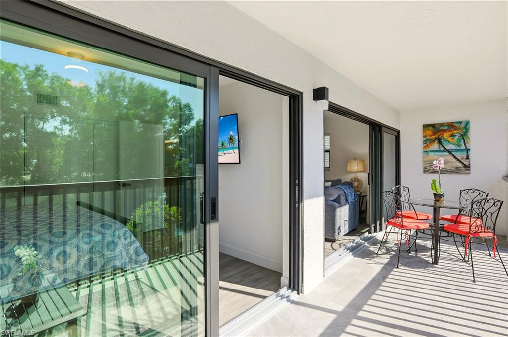 600 Neapolitan Way, Unit 254 Naples, FL 34103 - Photo 29 of 42 Balcony featuring outdoor dining space
