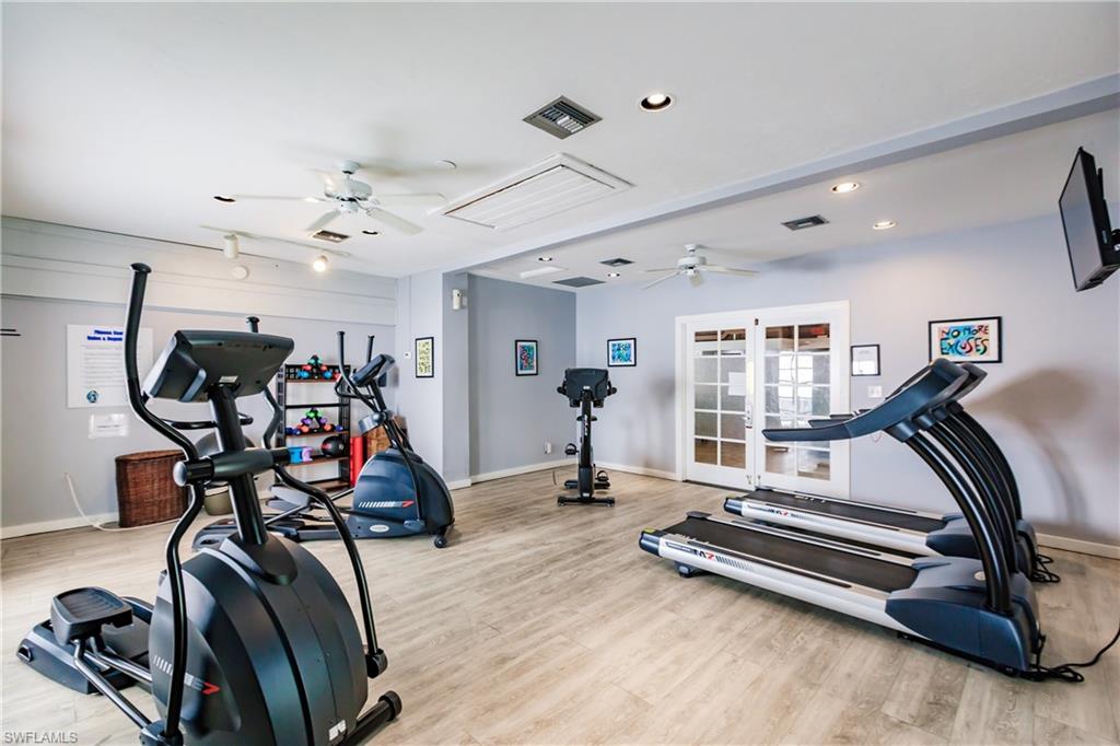 600 Neapolitan Way, Unit 254 Naples, FL 34103 - Photo 35 of 42 Exercise room with ceiling fan and recessed lighting