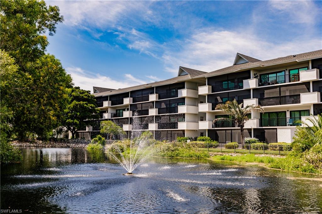 600 Neapolitan Way, Unit 254 Naples, FL 34103 - Photo 41 of 42 View of apartment building / complex featuring a water view