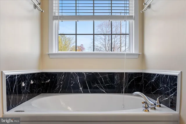 an aerial view of a house with a yard lake view and mountain view
