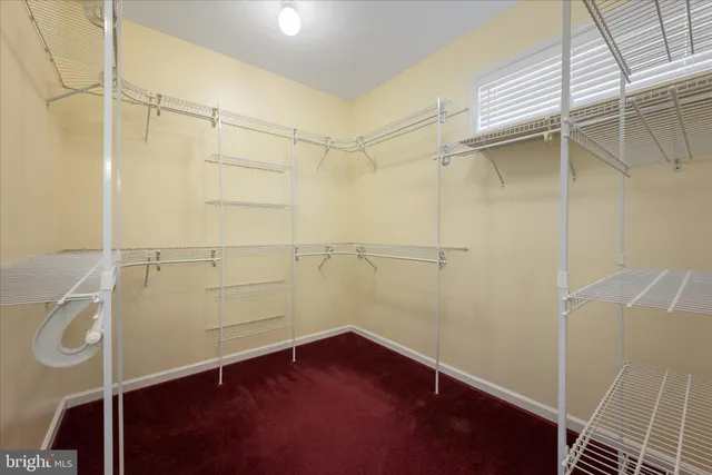 a view of a house with a swimming pool and sitting area