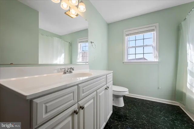 an aerial view of a house with outdoor space swimming pool and lake view