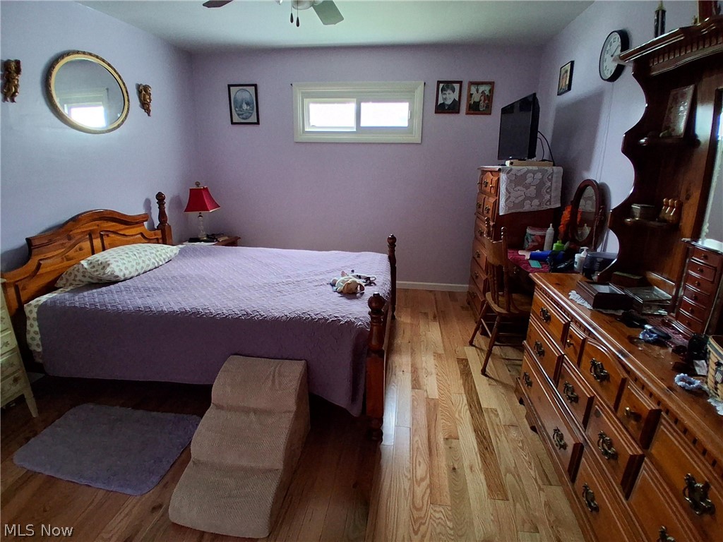 413 New England Ridge Road Washington, WV 26181 - Photo 10 of 15 owner's bedroom suite hardwood flooring