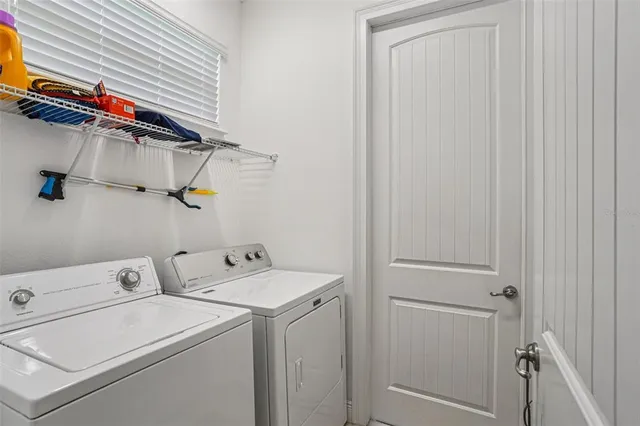 a utility room with dryer and washer