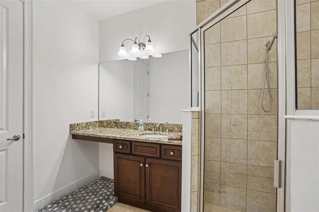 a bathroom with a sink a vanity and a mirror