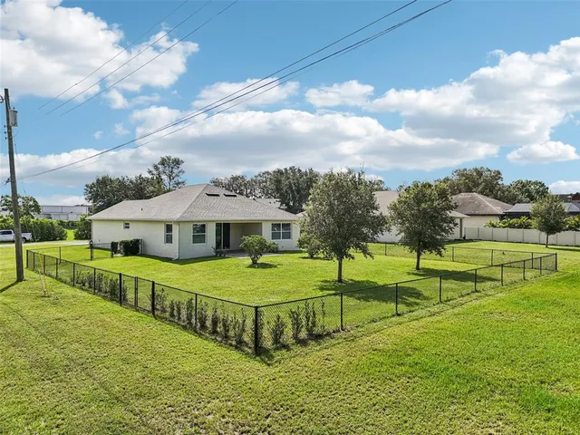 a view of a house with a big yard
