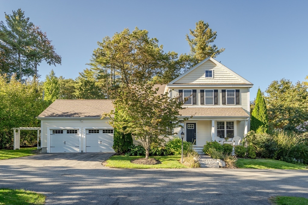 49 Quarry Road, Unit 49 Acton, MA 01720 - Photo 2 of 42 a front view of residential houses with yard and trees