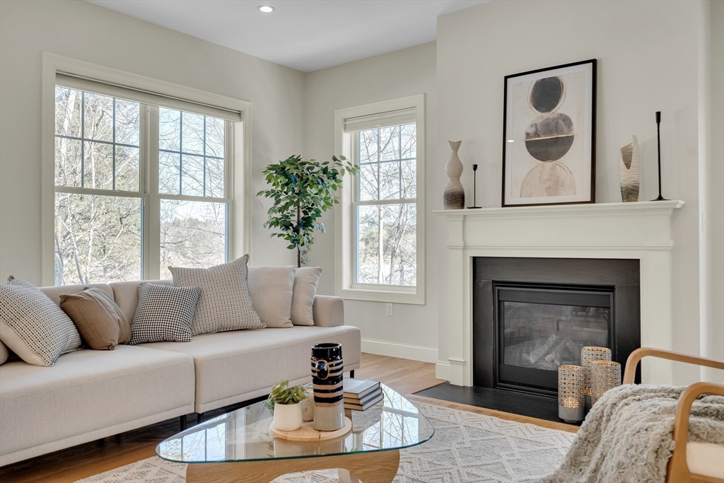 49 Quarry Road, Unit 49 Acton, MA 01720 - Photo 5 of 42 a living room with furniture and a fireplace