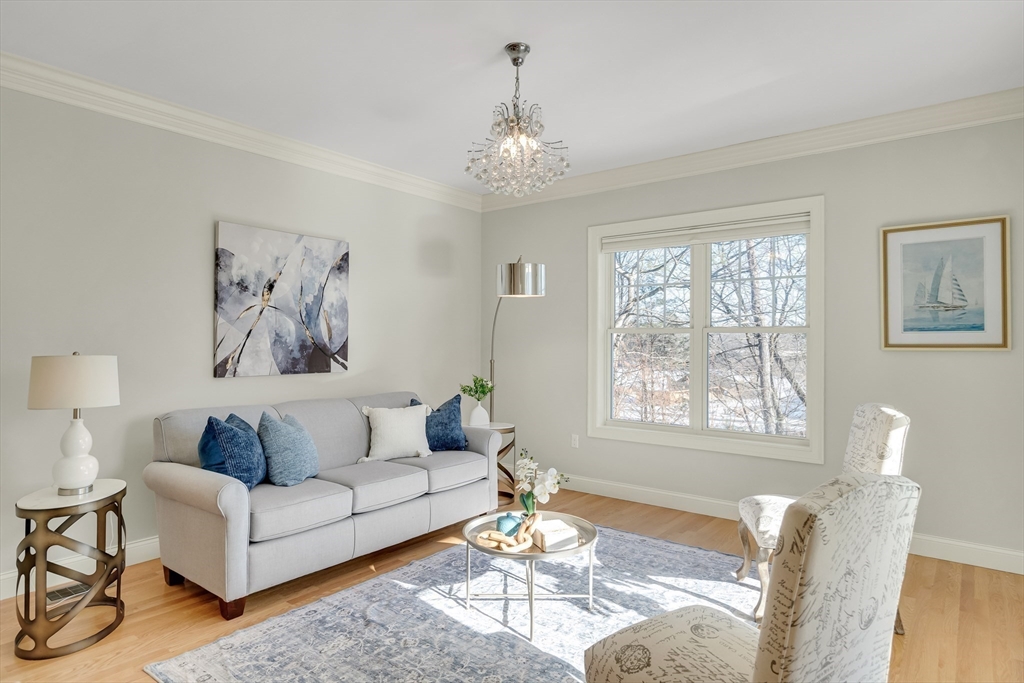 49 Quarry Road, Unit 49 Acton, MA 01720 - Photo 6 of 42 a living room with furniture and a large window