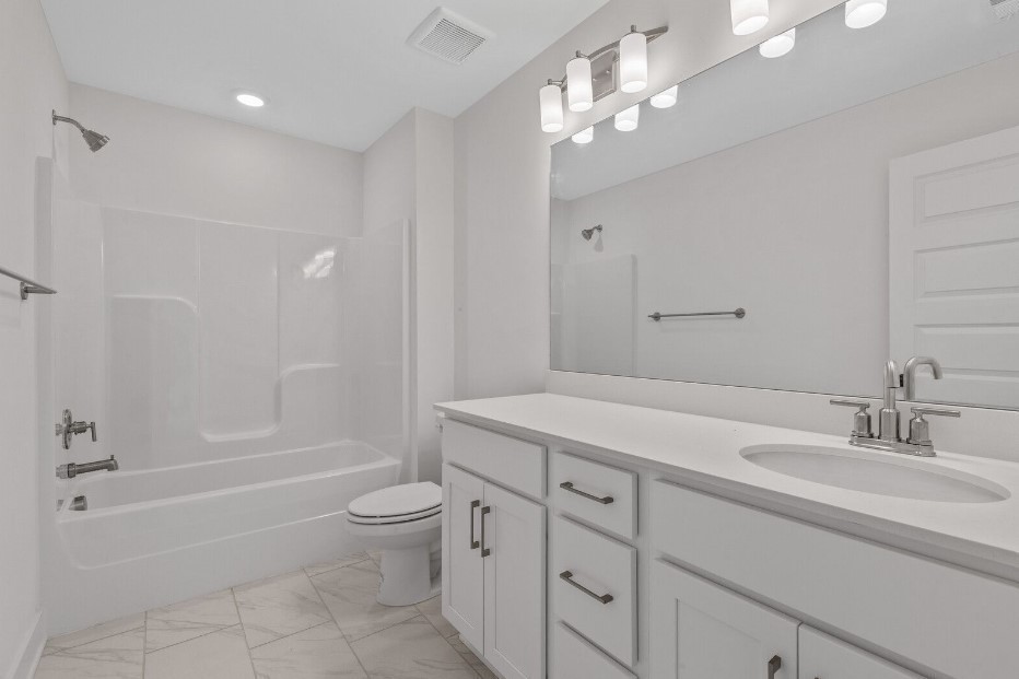 826 Sugarbush Ln Spring Hill Spring Hill, TN 37174 - Photo 13 of 18 a bathroom with a granite countertop sink a toilet and bathtub