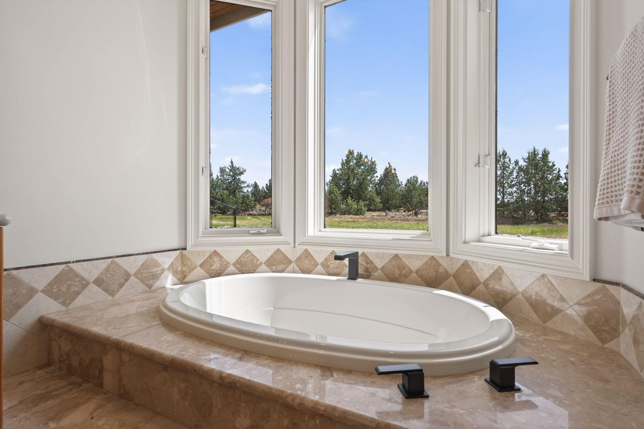 20180 Winston Loop Bend, OR 97703 - Photo 24 of 59 a bathroom with a sink and a bathtub