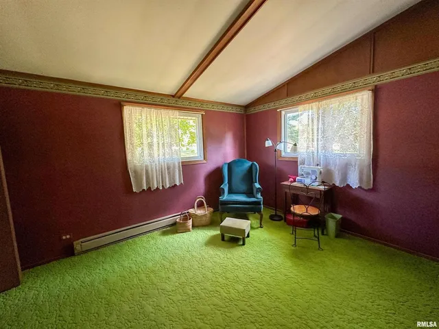 a room with pool table and windows