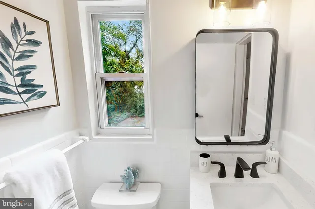 a bathroom with a bathtub and a sink