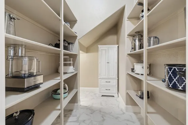 a room with furniture a washer and dryer