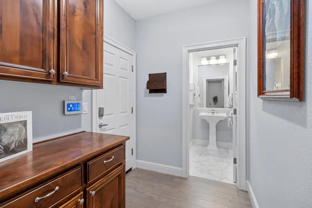 a view of cabinets and wooden floor