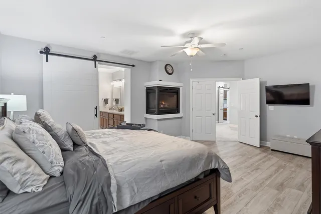 a spacious bathroom with a double vanity sink mirror and shower