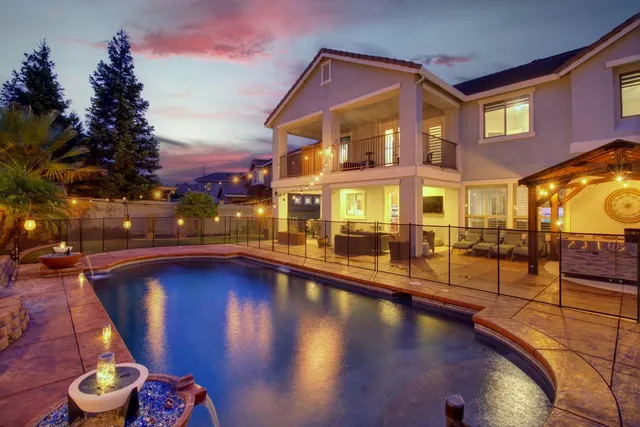 a view of living room kitchen and patio