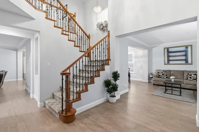 a view of an entryway with wooden floor