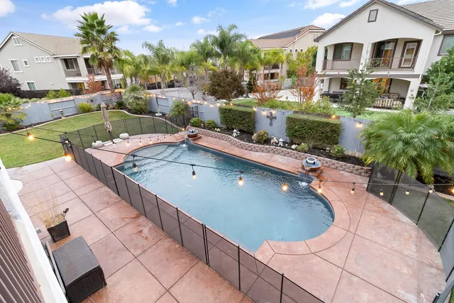 a view of a swimming pool with a patio