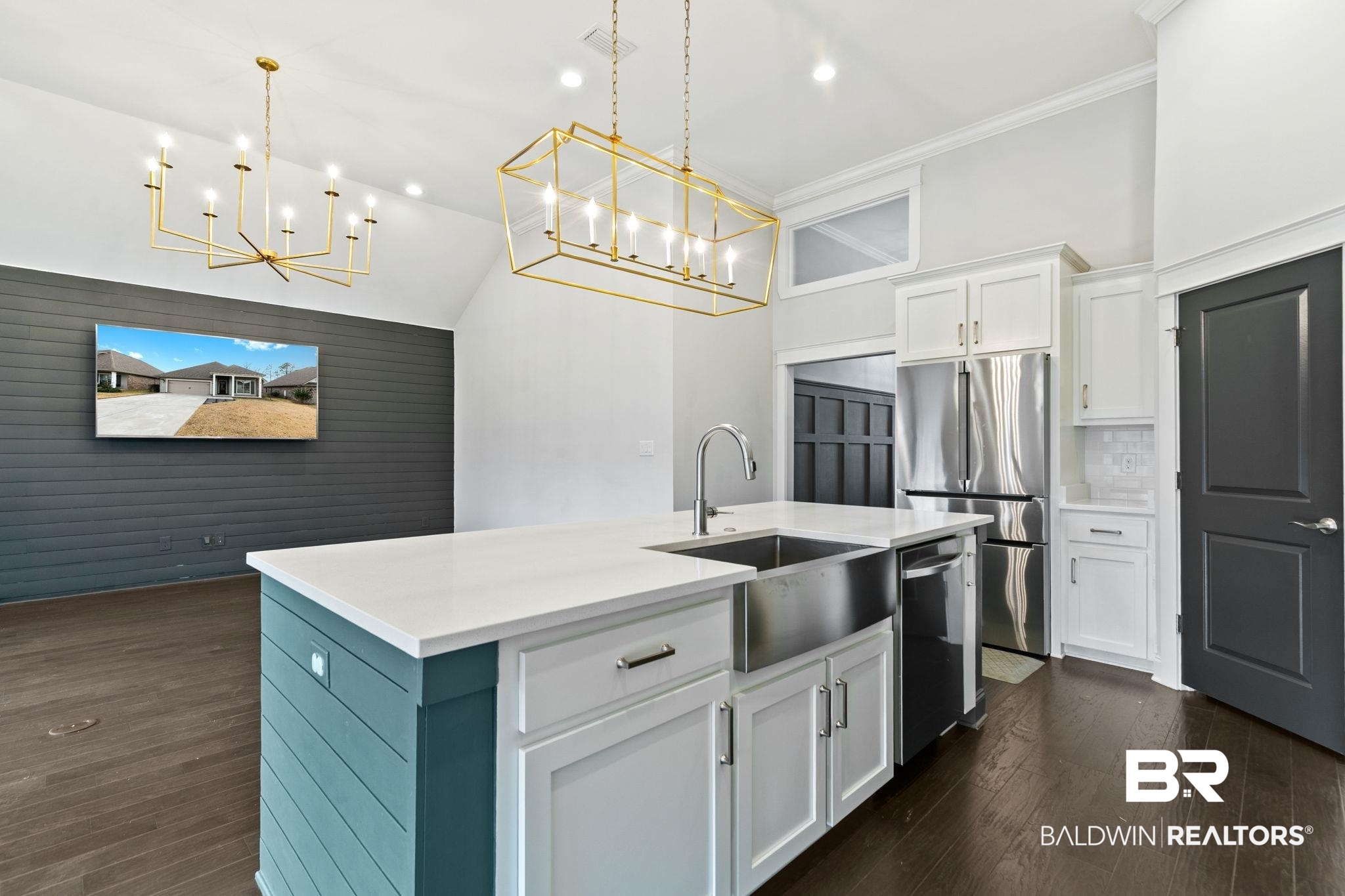 31654 Canopy Loop Daphne, AL 36527 - Photo 15 of 64 Kitchen with white cabinets, an island with sink, stainless steel appliances, dark wood-style flooring, and crown molding
