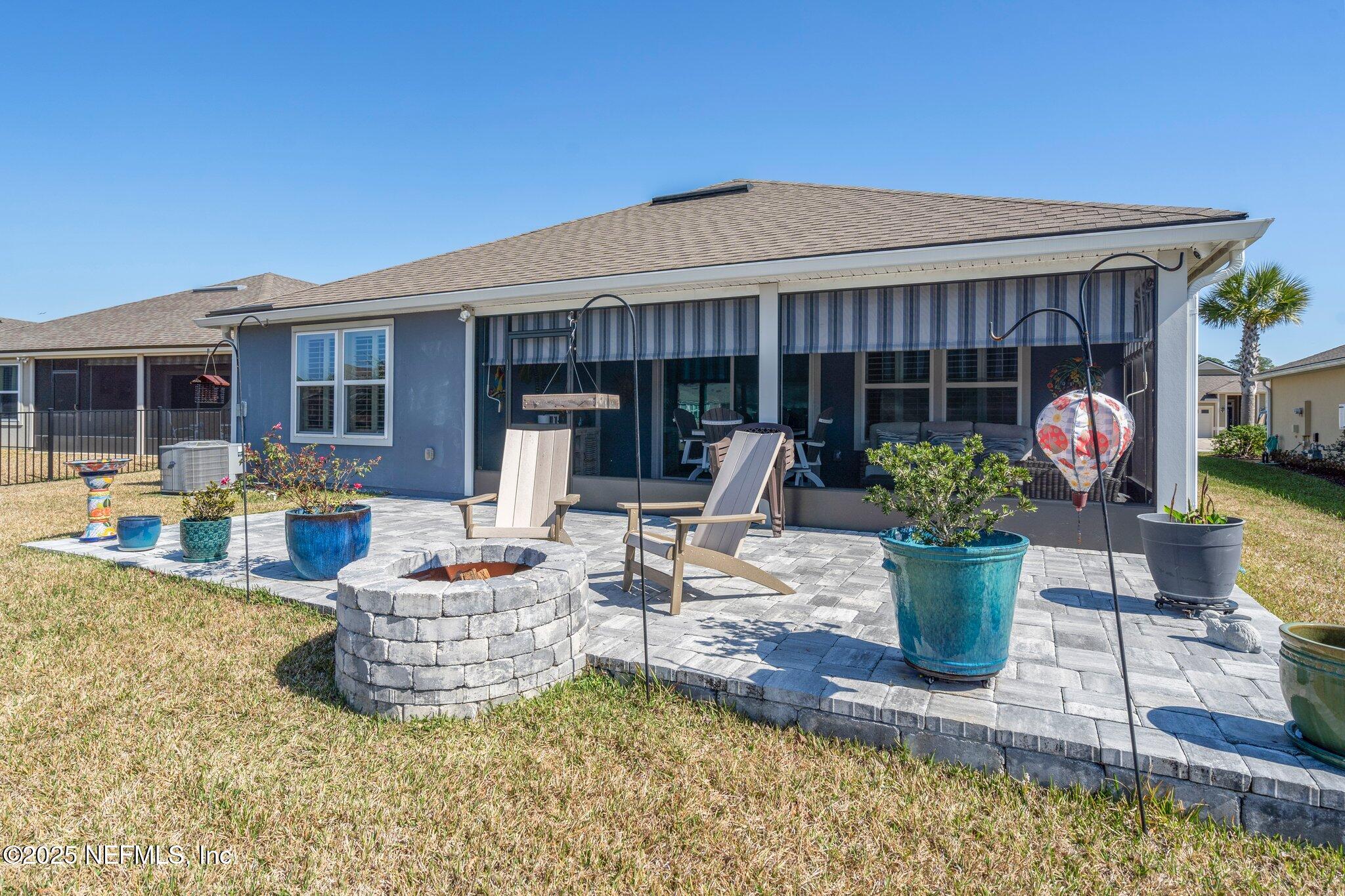 975 Parkland Trail St. Augustine, FL 32095 - Photo 31 of 52 a view of a house with patio