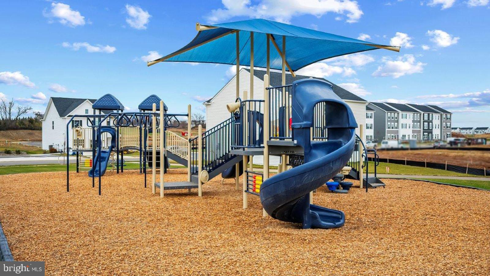409 Eclipse Street Ranson, WV 25438 - Photo 11 of 14 Vibrant playground under a sunny sky.