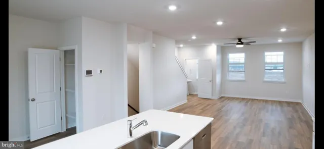 a view of a hallway and wooden floor