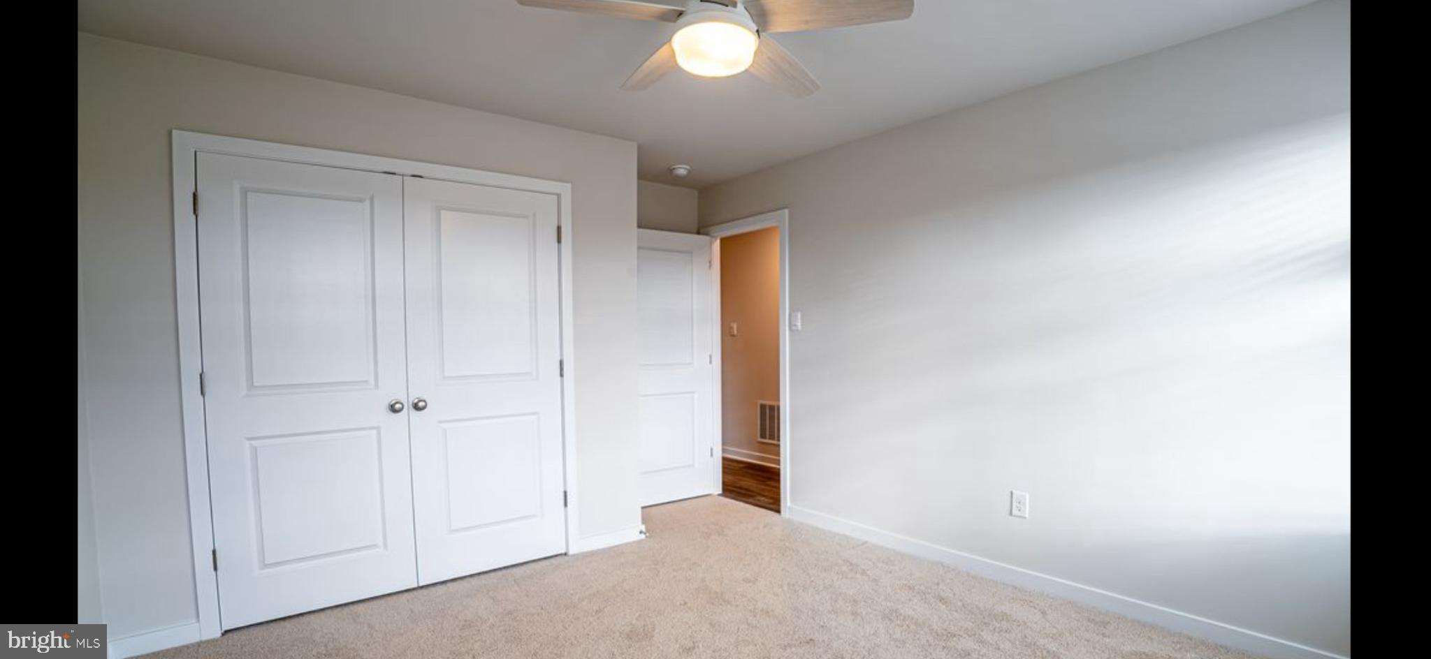 409 Eclipse Street Ranson, WV 25438 - Photo 9 of 14 Bright and airy bedroom with modern touches.