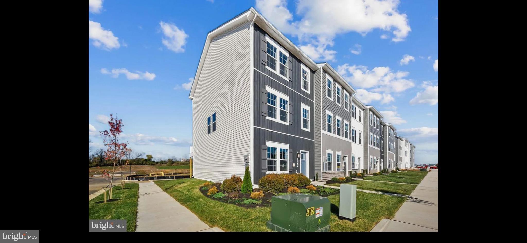 409 Eclipse Street Ranson, WV 25438 - Photo 10 of 14 Modern townhomes with vibrant landscaping.