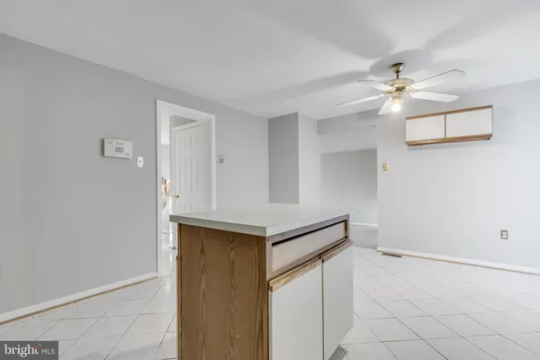 a utility room with cabinets and a window