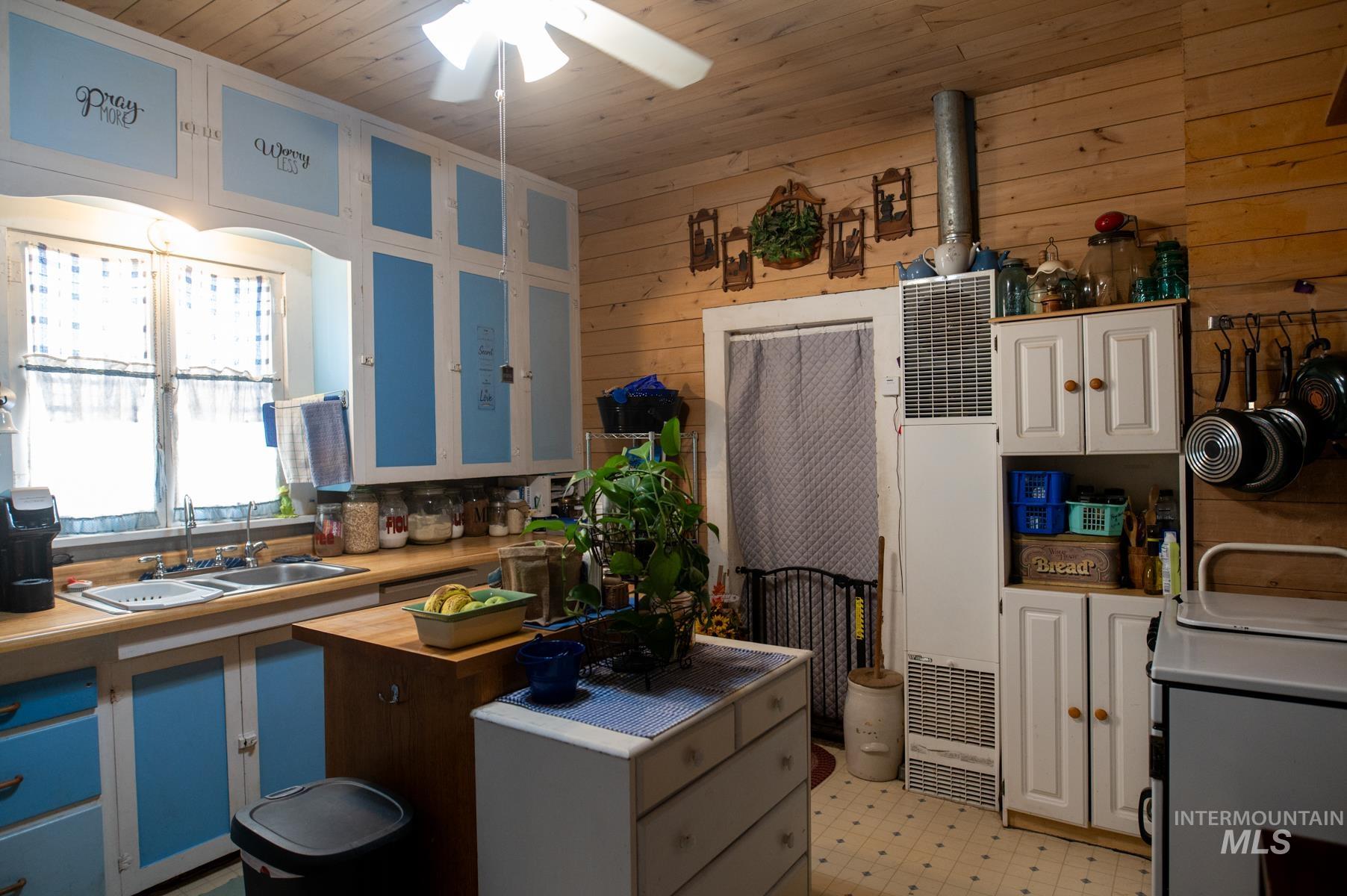 736 East Main Street Weiser, ID 83672 - Photo 18 of 33 Kitchen featuring wood-finish wall paneling and a wood-finish ceiling